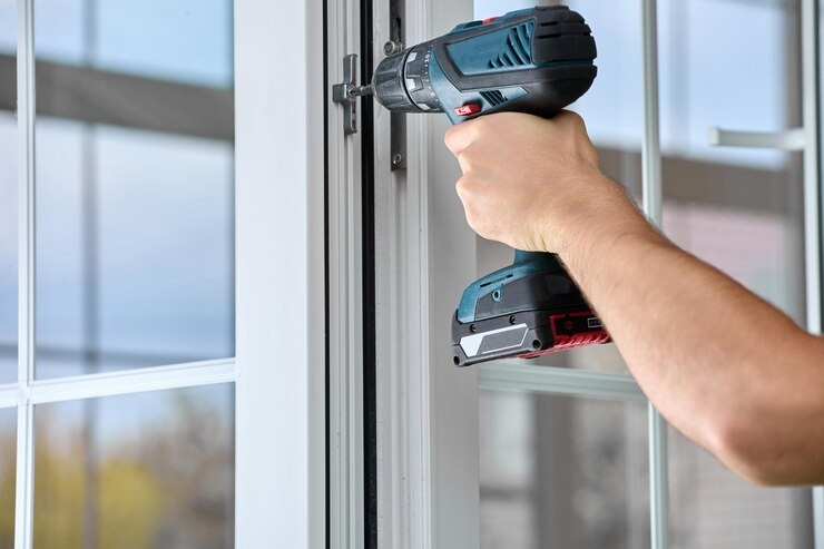 men is working screen door repairs